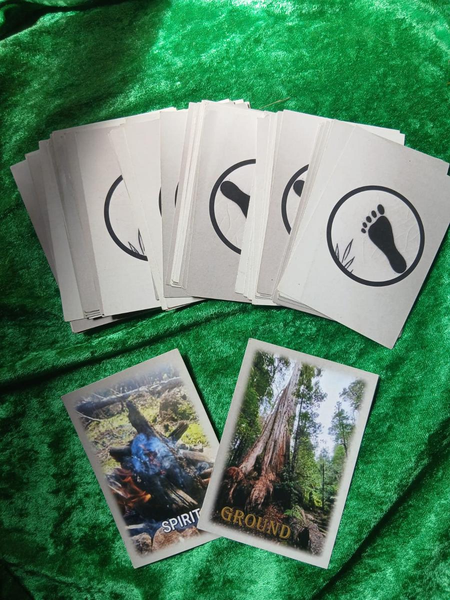 Mother Earth Quest Cards spread on green velvet, with the Spirit and Ground cards face up