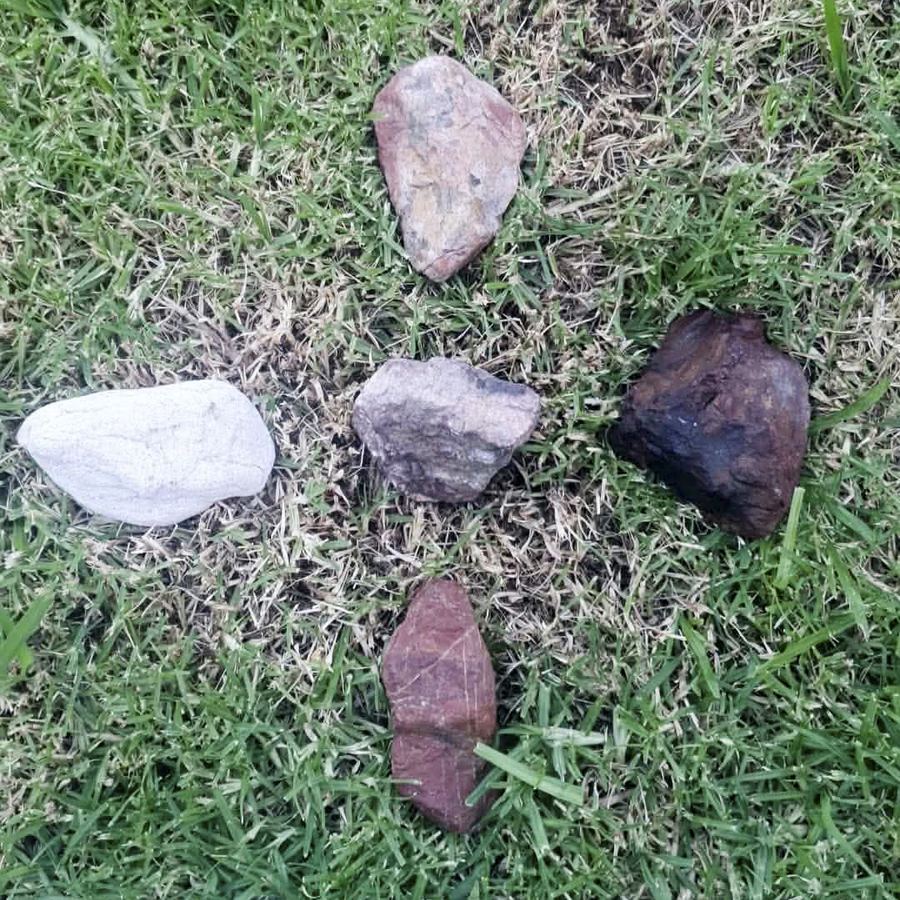 Teula’s teaching rocks: five stones laid out in a cross on the grass